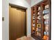 A home elevator and display case featuring a collection of retro radios and clocks at 501 Brightwaters Ne Blvd, St Petersburg, FL 33704