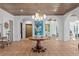 Stunning home entry with terracotta tile flooring, an ornate table, and arched doorways to living spaces at 501 Brightwaters Ne Blvd, St Petersburg, FL 33704