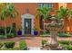 Stunning front entrance featuring an ornate fountain and lush landscaping at 501 Brightwaters Ne Blvd, St Petersburg, FL 33704