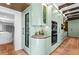 Gourmet kitchen boasting a wine fridge, stainless steel ovens, and ample counter space at 501 Brightwaters Ne Blvd, St Petersburg, FL 33704