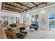 Inviting living room with stylish furnishings, an eye-catching geometric ceiling, and an abundance of natural light at 501 Brightwaters Ne Blvd, St Petersburg, FL 33704