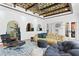 Stylish living room with unique ceiling design, comfortable seating, and tiled flooring at 501 Brightwaters Ne Blvd, St Petersburg, FL 33704