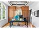 Bright office featuring custom built-in wood cabinets, a decorative desk and abundant natural light at 501 Brightwaters Ne Blvd, St Petersburg, FL 33704