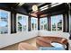 Stylish sitting room featuring large windows with water views, hardwood floors, and unique lighting at 501 Brightwaters Ne Blvd, St Petersburg, FL 33704