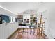 Bright studio with built-in shelving, art supplies, and wood floors at 501 Brightwaters Ne Blvd, St Petersburg, FL 33704
