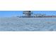 Open water view featuring a pier and the Dali Museum in the distance at 501 Brightwaters Ne Blvd, St Petersburg, FL 33704