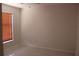 Bedroom showing a bright room with a window, light tiled floor, and a neutral color scheme at 5581 Greyston St, Palm Harbor, FL 34685