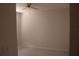 Bright bedroom featuring tile flooring and a ceiling fan, creating a comfortable atmosphere at 5581 Greyston St, Palm Harbor, FL 34685