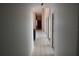 Hallway view showing flooring and the home's interior architecture at 5581 Greyston St, Palm Harbor, FL 34685
