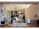 Open-concept kitchen overlooking the living room with stainless faucet and ceramic tile countertop at 5581 Greyston St, Palm Harbor, FL 34685