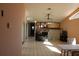 Open floor plan featuring vaulted ceilings, a fireplace, and sliding glass doors at 5581 Greyston St, Palm Harbor, FL 34685