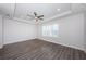 Spacious primary bedroom featuring a trey ceiling, fan, and natural light from shuttered windows at 575 53Rd N Ave, St Petersburg, FL 33703
