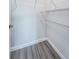 Walk-in closet with wooden floor and wire shelves providing organized storage solutions at 575 53Rd N Ave, St Petersburg, FL 33703