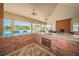 The outdoor covered patio includes a bar for entertaining and a view of the community pool at 575 53Rd N Ave, St Petersburg, FL 33703
