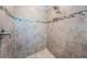 Shower features decorative tile, a built-in niche, and a rainfall showerhead at 575 53Rd N Ave, St Petersburg, FL 33703