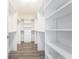 Large walk-in closet with custom shelving and hanging space, providing ample storage at 575 53Rd N Ave, St Petersburg, FL 33703