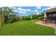 Expansive backyard with lush lawn, mature trees and privacy fence at 5806 Tulip Flower Dr, Riverview, FL 33578