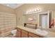 Bathroom features flamingo decor, framed mirror, and wooden vanity with sink at 5806 Tulip Flower Dr, Riverview, FL 33578