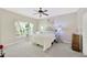 Cozy bedroom with a ceiling fan, a large window, and natural light at 5806 Tulip Flower Dr, Riverview, FL 33578