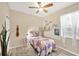 Bright bedroom with natural light, decorative accents, and a cozy bed at 5806 Tulip Flower Dr, Riverview, FL 33578