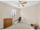 Bright bedroom featuring neutral walls, ceiling fan, carpet floors and window with bright light at 5806 Tulip Flower Dr, Riverview, FL 33578