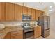 A well-equipped kitchen with stainless steel appliances and granite countertops at 5806 Tulip Flower Dr, Riverview, FL 33578