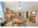 Open kitchen with a large island and seating, leading to the dining and living areas at 5806 Tulip Flower Dr, Riverview, FL 33578