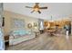 Open-concept living and dining area with hardwood floors and modern furnishings at 5806 Tulip Flower Dr, Riverview, FL 33578