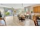 Bright living area with plenty of natural light, views to the backyard and an adjacent dining area at 5806 Tulip Flower Dr, Riverview, FL 33578