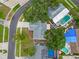 Aerial view of a residential property showcasing the home's roof, landscaping, and surrounding neighborhood at 6204 Walsh Ln, Tampa, FL 33625