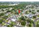 Aerial view of a residential area with lush greenery and lake views in the distance at 6204 Walsh Ln, Tampa, FL 33625
