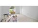 Bedroom with arched window, closet, and plenty of natural light at 6204 Walsh Ln, Tampa, FL 33625