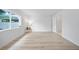 Bright bedroom featuring large window and hardwood floors at 6204 Walsh Ln, Tampa, FL 33625