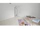 Bright bedroom with an open door leading to another room at 6204 Walsh Ln, Tampa, FL 33625