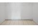 Empty walk-in closet with white walls and tiled flooring, perfect for customization and organization at 6204 Walsh Ln, Tampa, FL 33625
