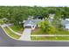 Charming home with a well-manicured lawn, a paved driveway, and mature trees offering curb appeal at 6204 Walsh Ln, Tampa, FL 33625