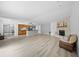 Spacious living room with fireplace open to the kitchen with breakfast bar at 6204 Walsh Ln, Tampa, FL 33625