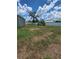 Spacious backyard enclosed with a white vinyl fence and plenty of room for activities at 7056 Landover Blvd, Spring Hill, FL 34608