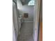 Bathroom features tiled floors, granite countertop, and decorative window at 7056 Landover Blvd, Spring Hill, FL 34608