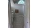 Bathroom features tiled floors, granite countertop, and decorative window at 7056 Landover Blvd, Spring Hill, FL 34608
