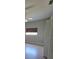 Bright bedroom with a ceiling fan, window with blinds, and light hardwood floors at 7056 Landover Blvd, Spring Hill, FL 34608