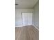 Spacious bedroom with wood flooring and a closet at 7056 Landover Blvd, Spring Hill, FL 34608