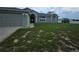 Charming single Gathering home with an attached two car garage and quaint landscaping at 7056 Landover Blvd, Spring Hill, FL 34608