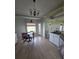 Bright kitchen with a small dining area and a window letting in natural light at 7056 Landover Blvd, Spring Hill, FL 34608
