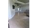 Spacious living room with wood floors, ceiling fan, and neutral wall color at 7056 Landover Blvd, Spring Hill, FL 34608