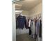 Walk-in closet with custom shelving and ample storage space at 7056 Landover Blvd, Spring Hill, FL 34608