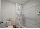 Clean bathroom featuring a shower and bathtub combination with a white shower curtain at 7737 Rosewood Garden Loop, Tampa, FL 33637