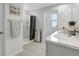 Bathroom featuring a shower, vanity with countertop, and neutral color tones at 7737 Rosewood Garden Loop, Tampa, FL 33637
