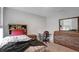Cozy bedroom featuring a dresser, desk, and bedside table perfect for any resident at 7737 Rosewood Garden Loop, Tampa, FL 33637