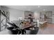 Open-concept kitchen and dining area, with granite counters and stainless steel appliances at 7737 Rosewood Garden Loop, Tampa, FL 33637